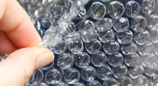 Bubble Wrap For Less Than Container Load Shipping A man is popping bubble wrap used to wrap parcel from China to Malaysia.
